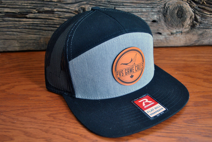 7 panel flat bill snapback with leather patch